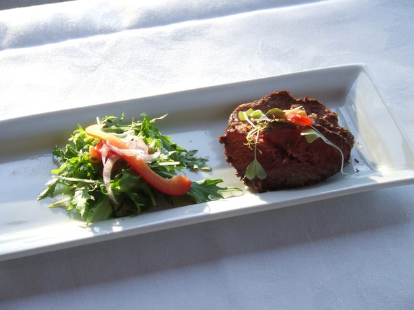 Spice-encrusted lamb rump and redcurrant dressing